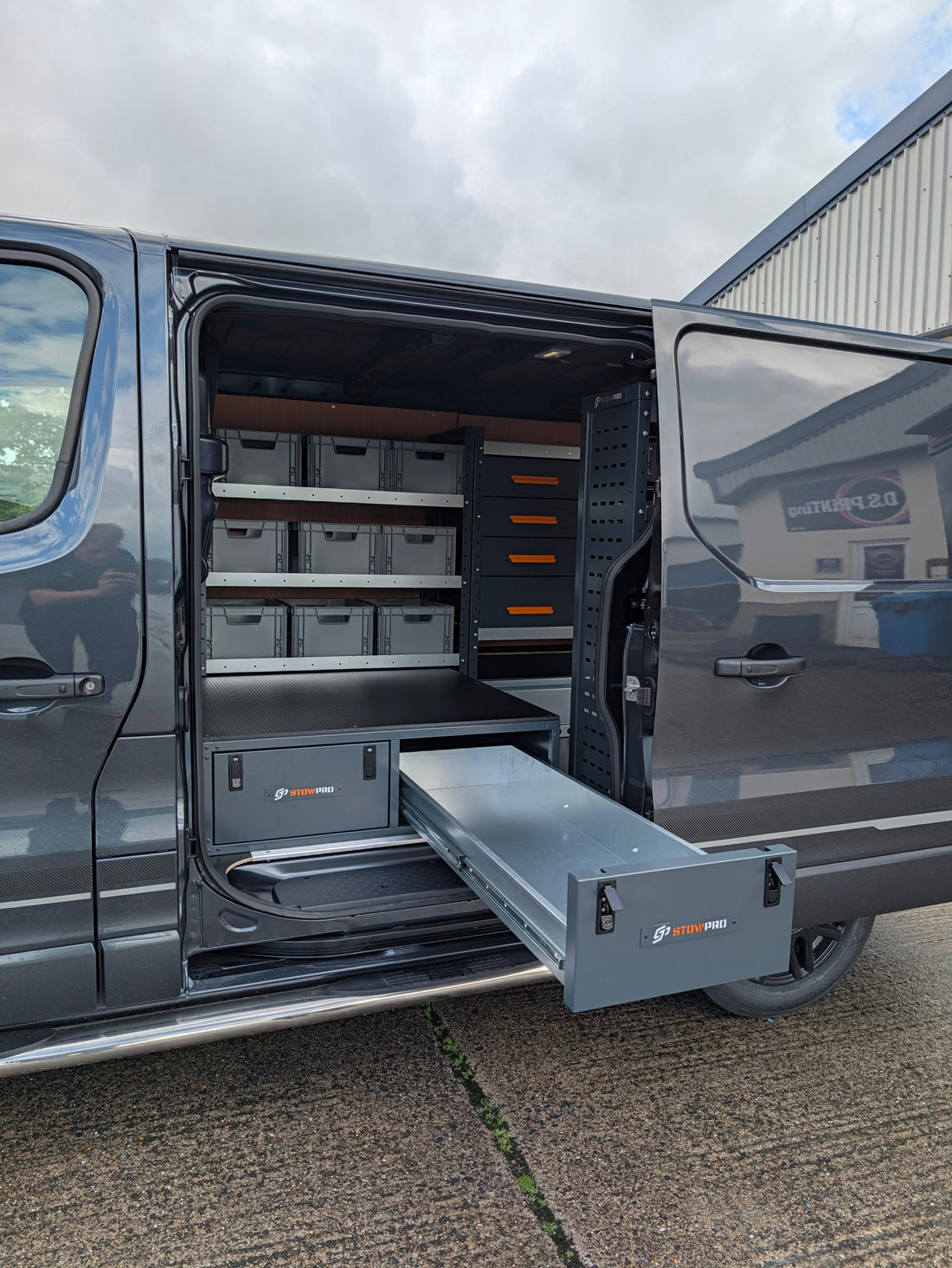 The inside of a Renault Trafic with racking